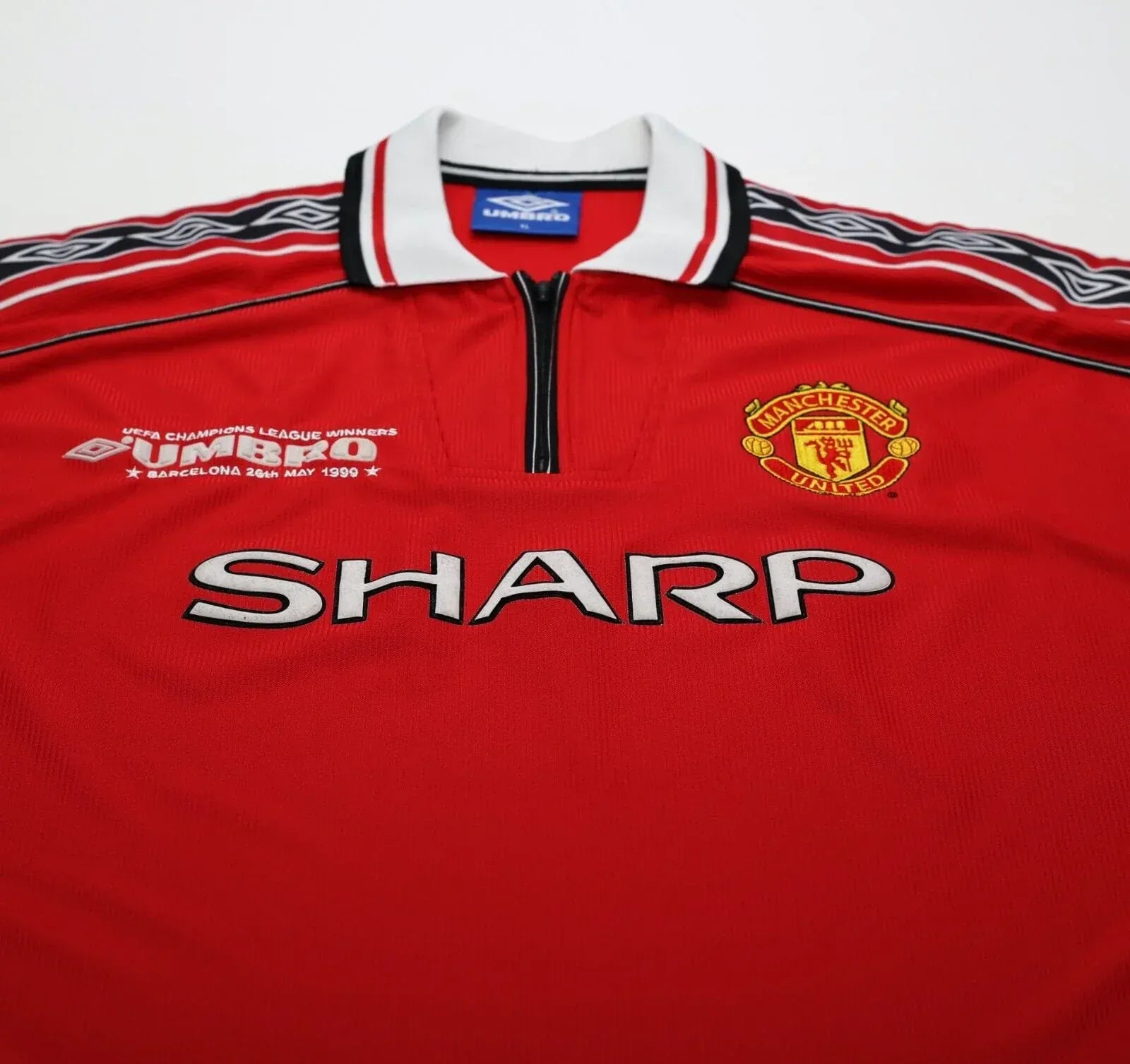 Red Manchester United shirt with Sharp sponsor