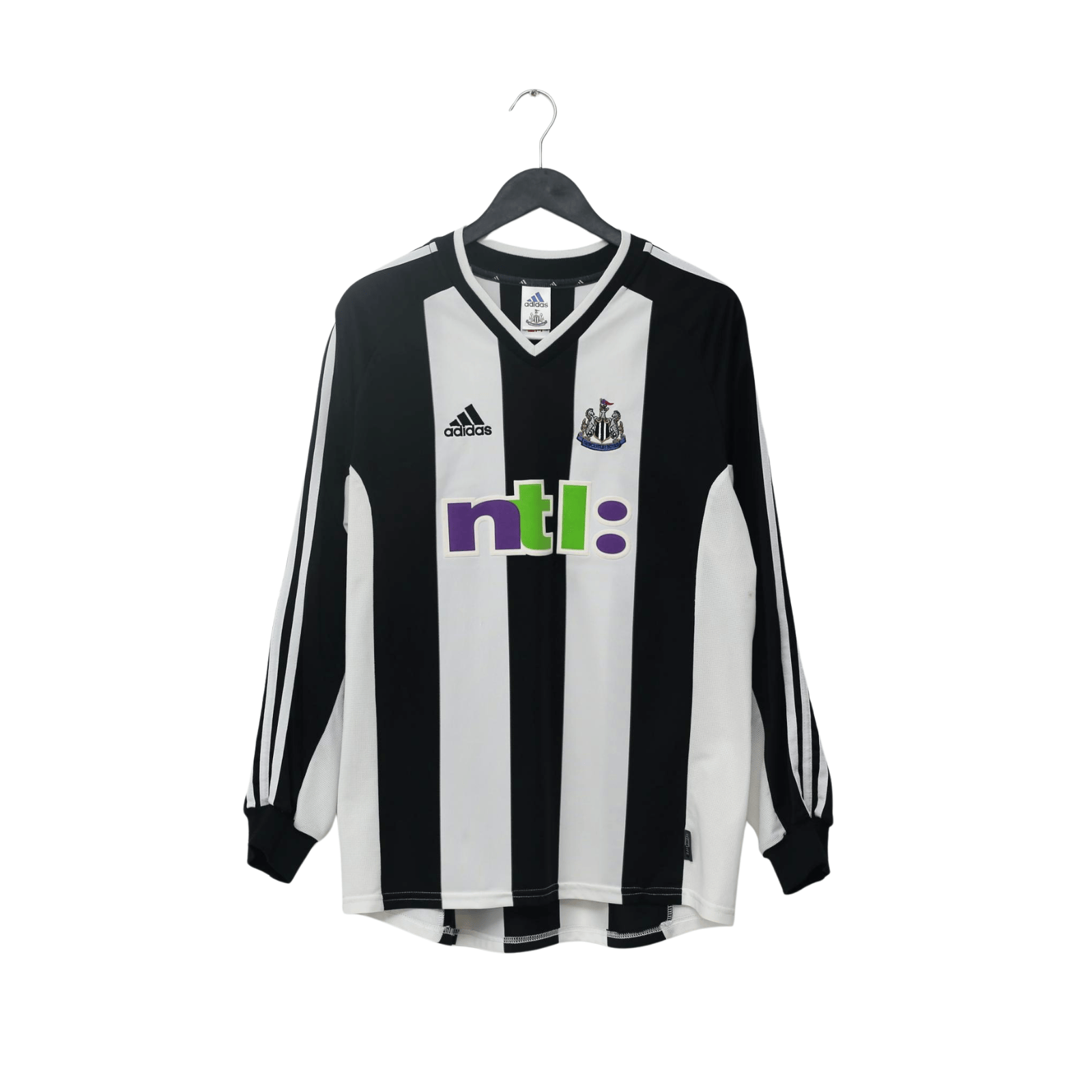 A black and white vertically striped long-sleeve soccer jersey hanging on a black hanger against a plain white background. The back of the jersey features the name 'SHEARER' and the number '9' in white.
